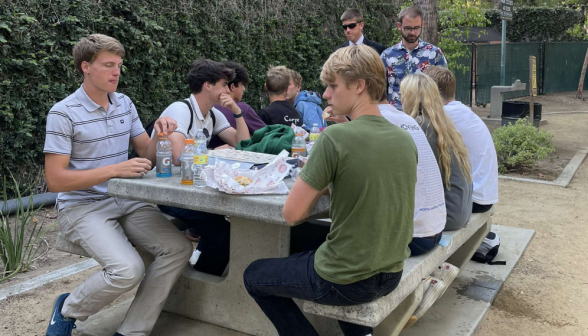 Students at one of the picnic tables