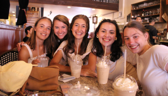 Six pose with their drinks