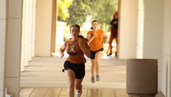 Two sprinting past the fountain corner