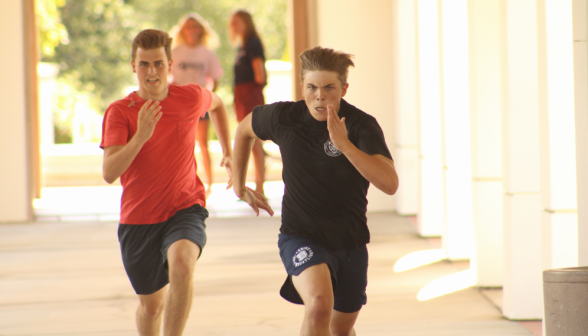 Two students running at full tilt
