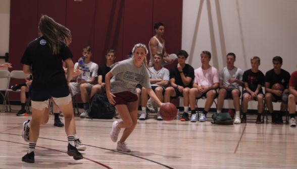 A student progresses with the ball