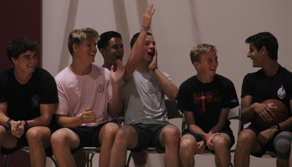 Students cheer from the sidelines