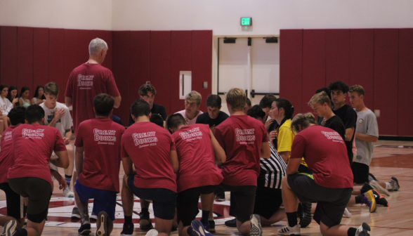 Fr. Walshe leads the men's teams in prayer