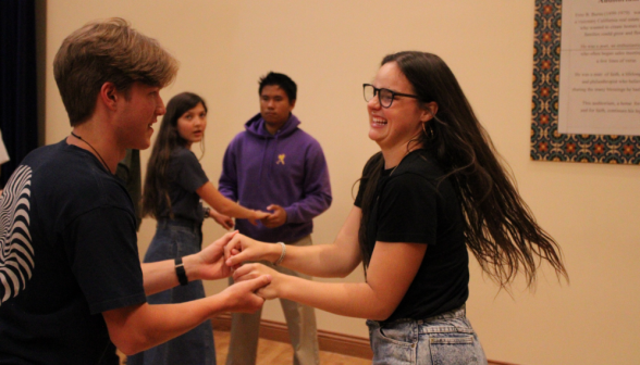 Two students dancing