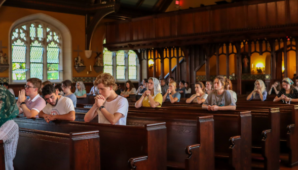 Another view of students praying the Rosary in the Chapel