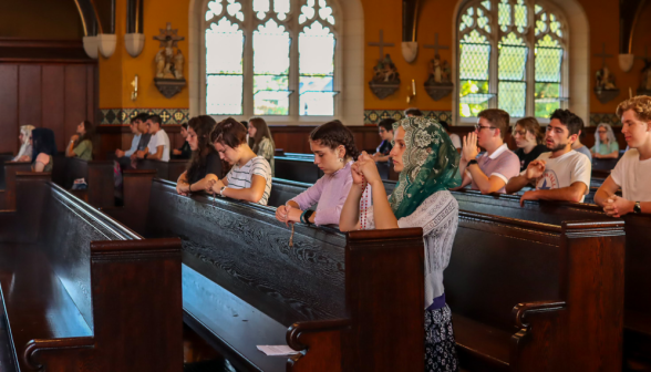 Another view of students praying the Rosary in the Chapel
