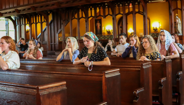 Another view of students praying the Rosary in the Chapel