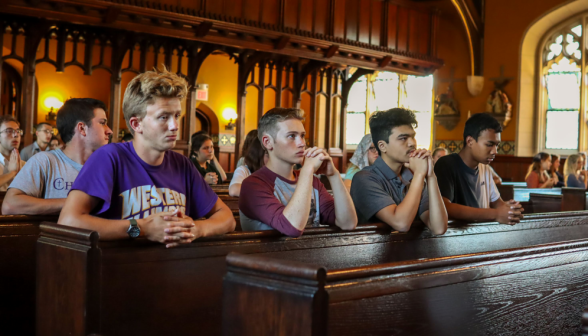 Students praying the Rosary in the Chapel