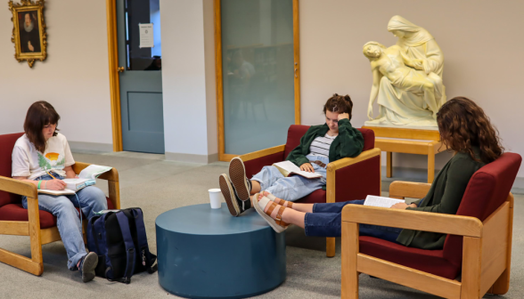 Students study in armchairs