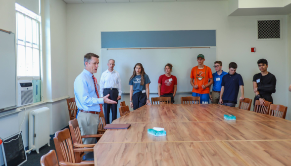 John Daly addresses students in the classroom