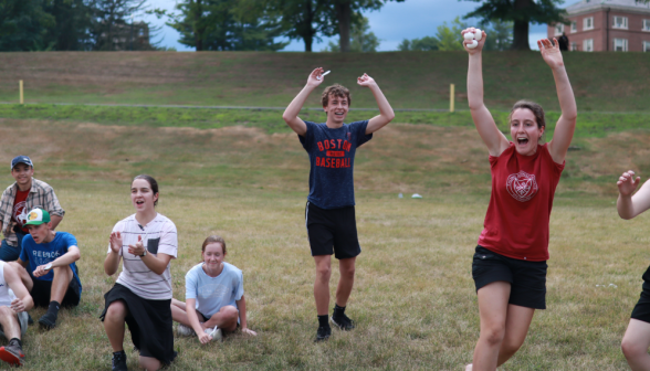 One team cheers, eggs and spoons in hand