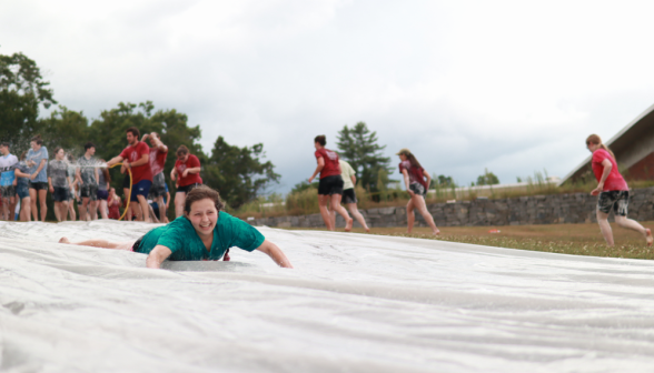 Another student going down the slide