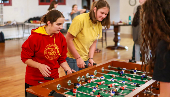 Two play foosball