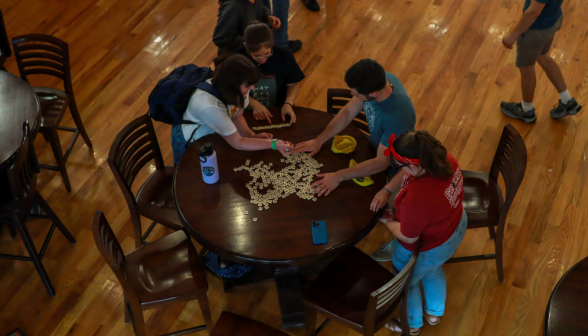 Overhead view: four play Bananagrams
