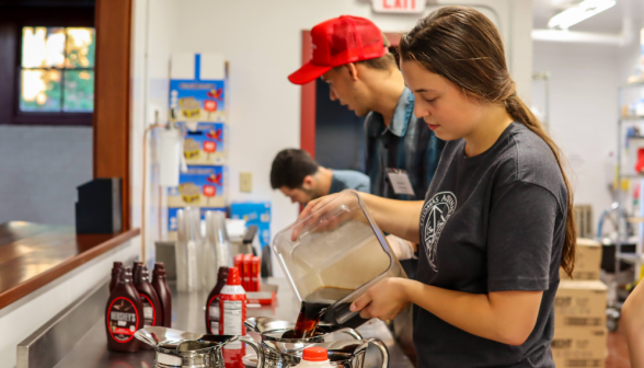 Staff make drinks in the coffee shop