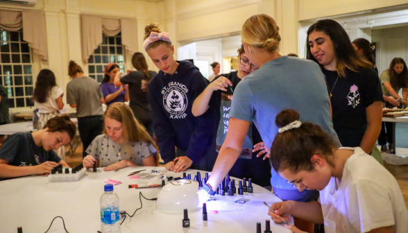 In the girls dorm, students do their nails