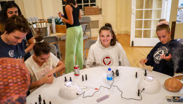 Students around the nail table