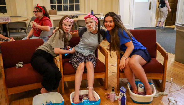 Three pose in masks and foot baths