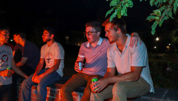 Students chatting on the courtyard wall