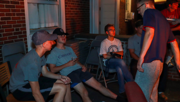 Students relaxing on chairs in the corner of the Merrill-Keep courtyard