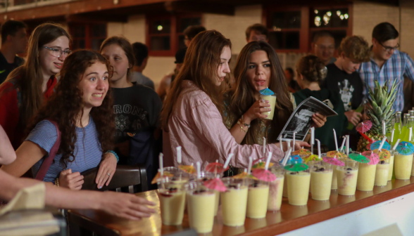 Students around the coffee shop counter