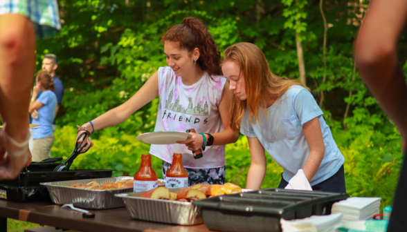 Two students serve themselves