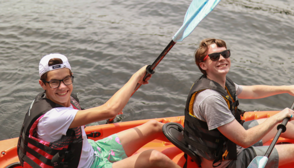 Two students rowing in their kayak