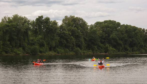 Three kayaks out on the river