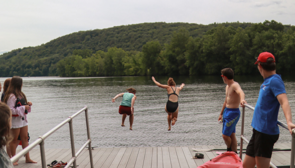 Two jump off the pier