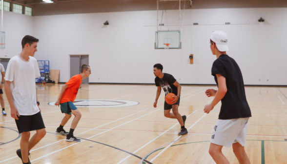 Students play basketball