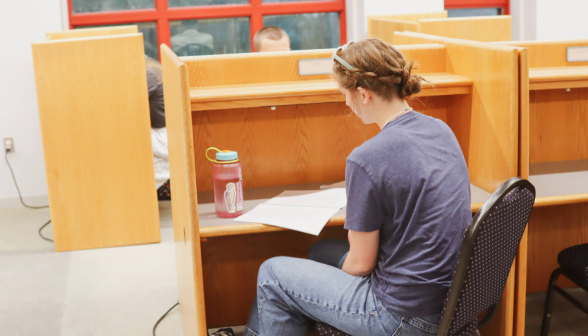 A student at an individual desk
