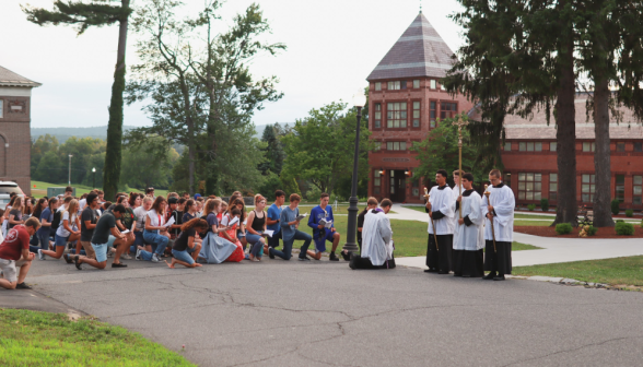 Students pray the Stations of the Cross