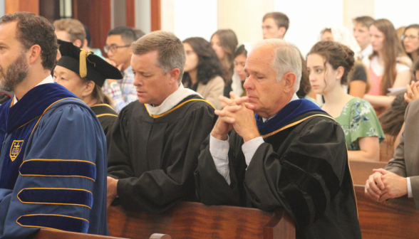 Faculty pray in the pews