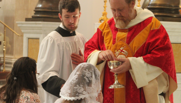 Fr. Michaels administers Communion