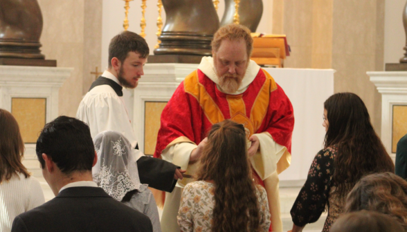 Fr. Michaels administers Communion
