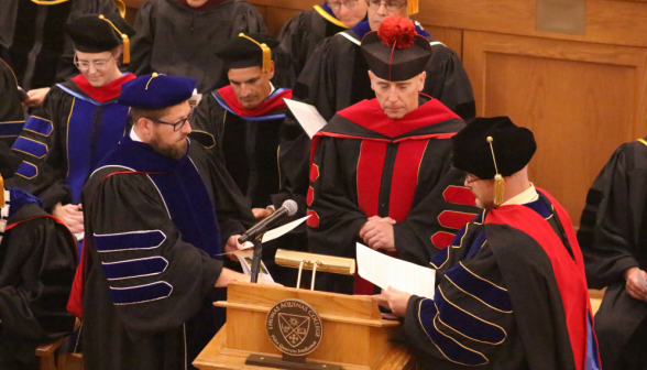 Fr. Marczewski witnesses as the new tutors take the Oath