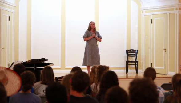 A student performs solo on the stage