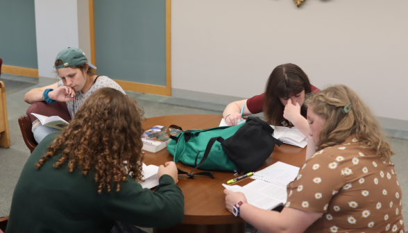 Four studying at a circular table