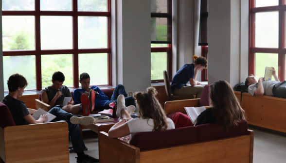 Many study in a corner of the library