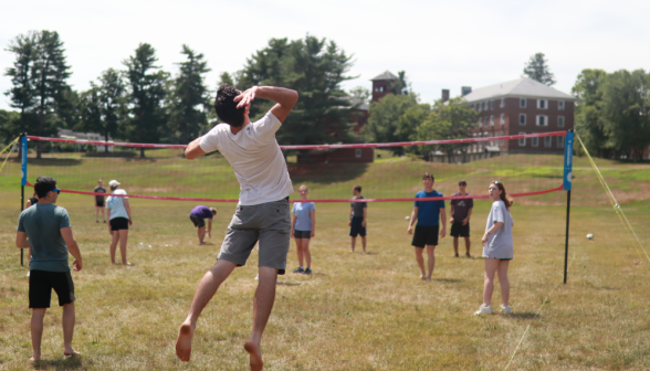 A student hits the ball