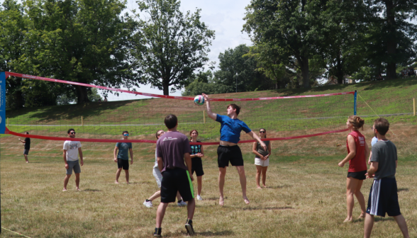 A student hits the ball