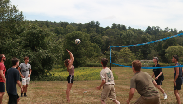 A student hits the ball