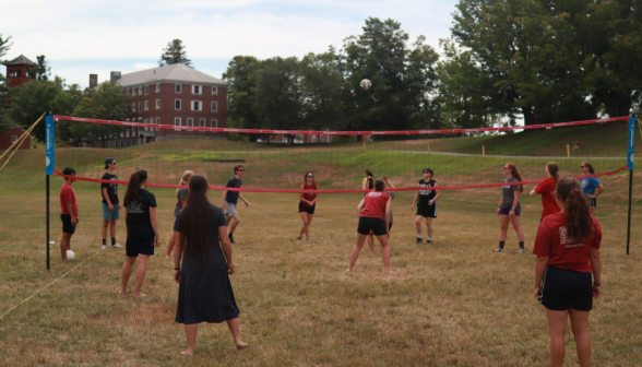 Students play volleyball