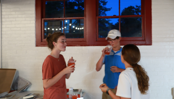 Three chat over drinks