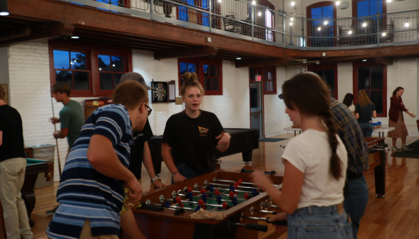 Students play foosball