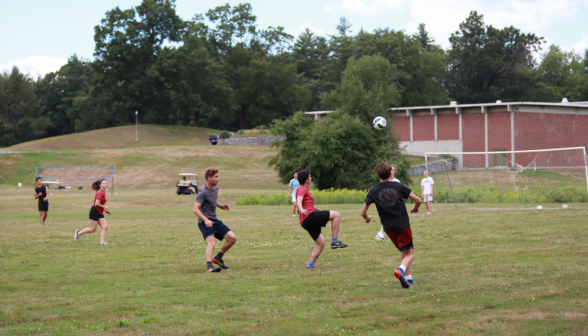 Students playing soccer