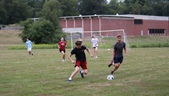 Students playing soccer