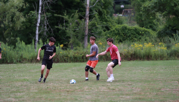 Students playing soccer