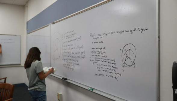 A student practices at the board