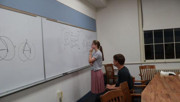 A student practices at the board